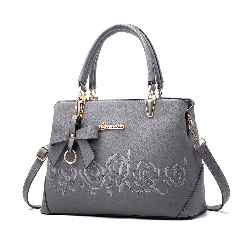 Elegant & Stijlvol – Luxe Handtas met Bloemenborduursel en Strikdetail 